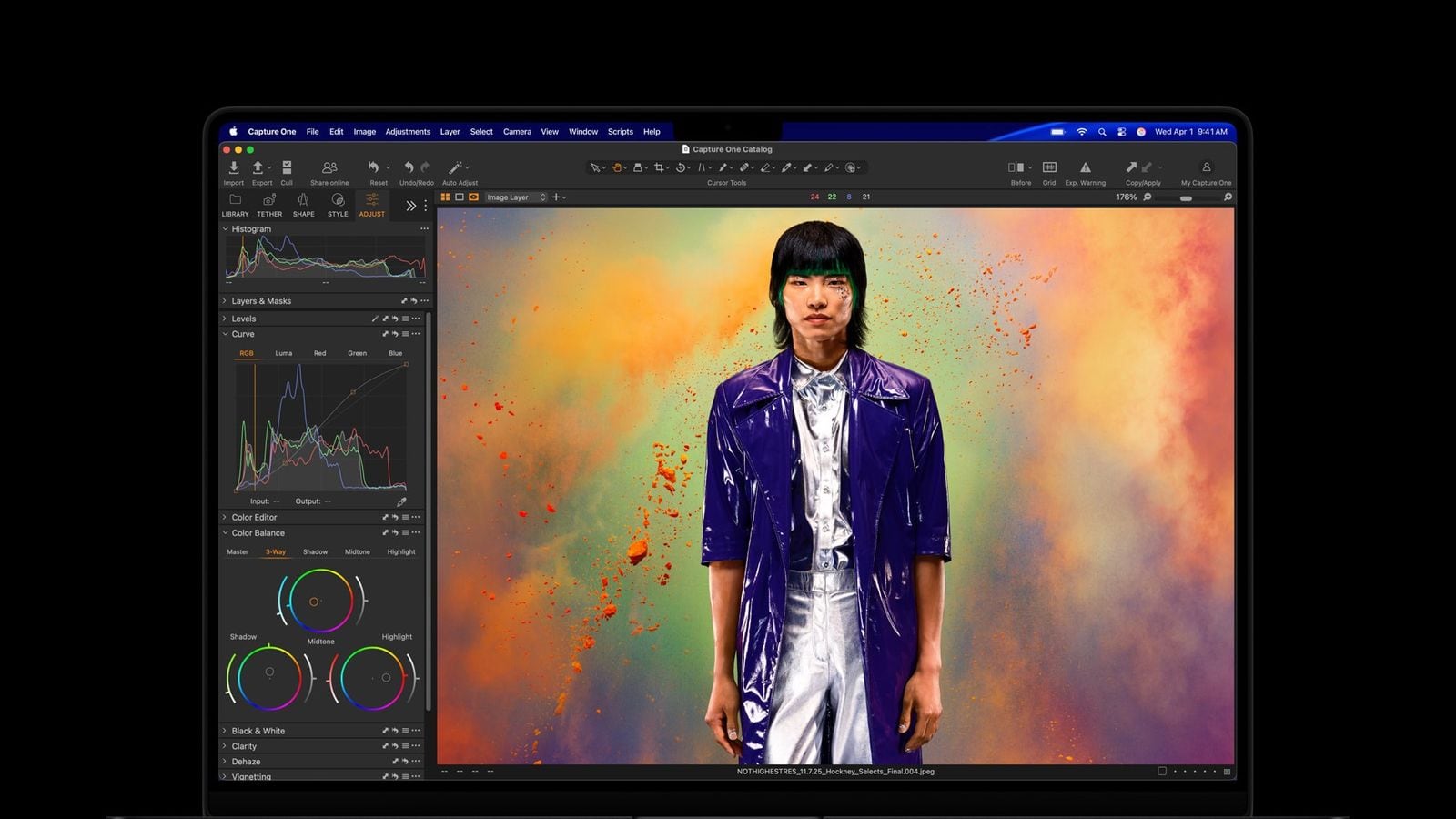 The new MacBook Pro is shown open with a Capture One editing screen.